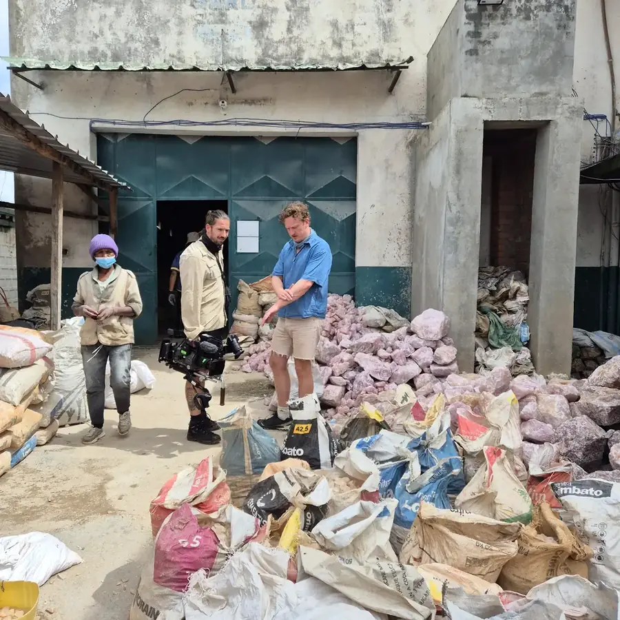 Documentary crew filming at a rose quartz depot